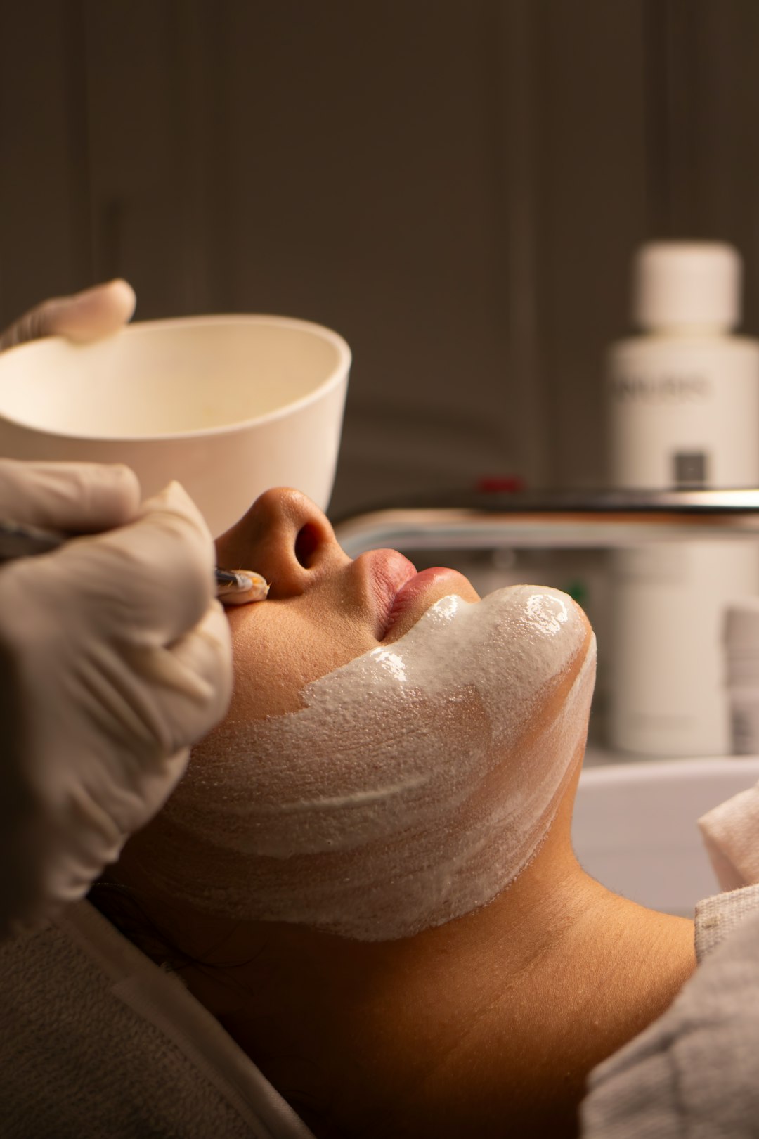 Client receiving a facial treatment at Elara Aesthetics